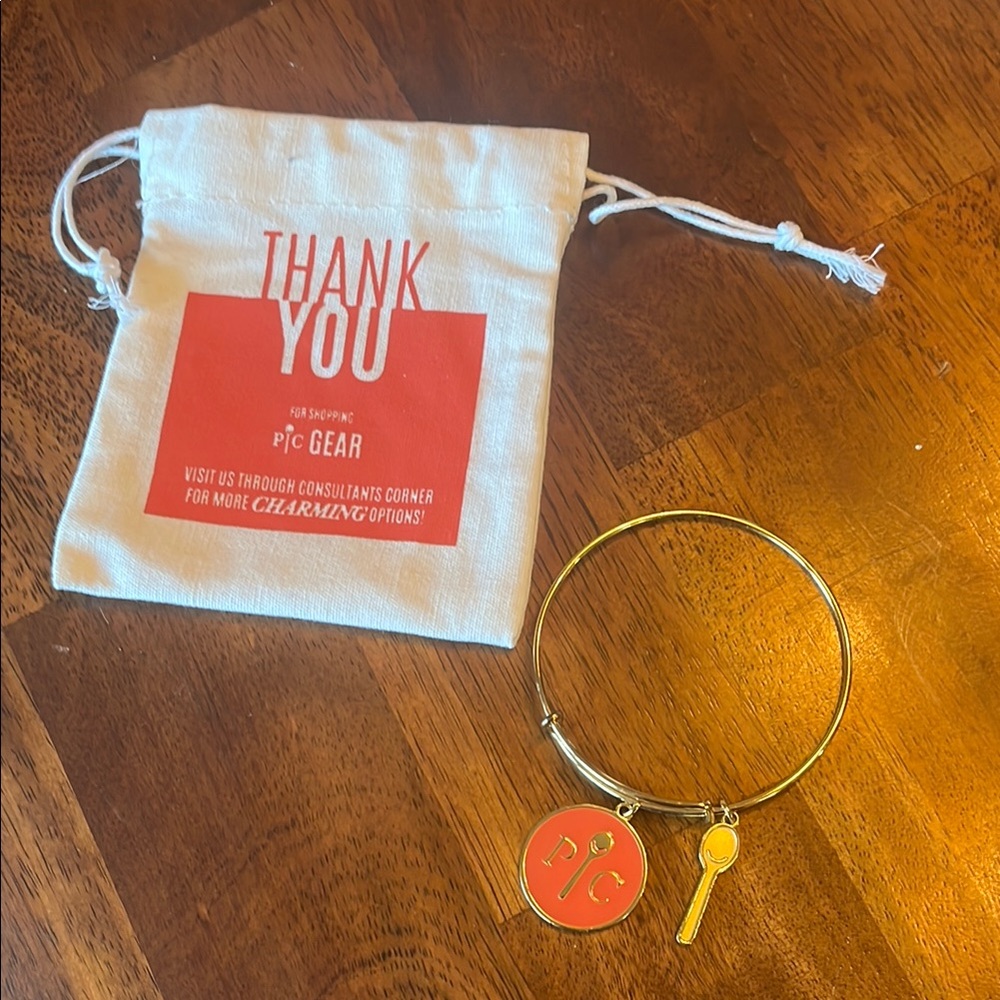 Pampered Chef Gold Bracelet with Orange Charm
